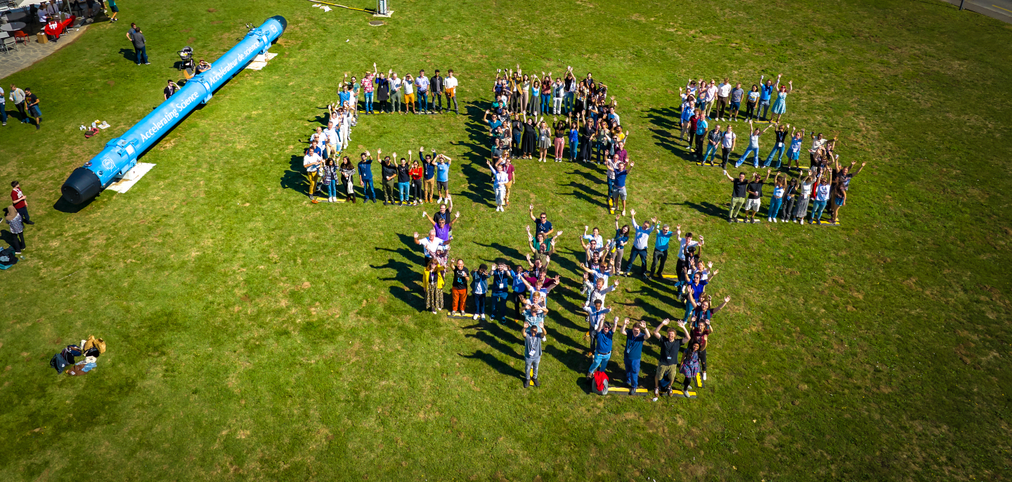 Aerial view of dozens of people forming the CAS40 logo 